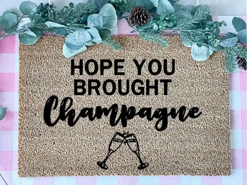 A Funny Champagne Welcome Mat
